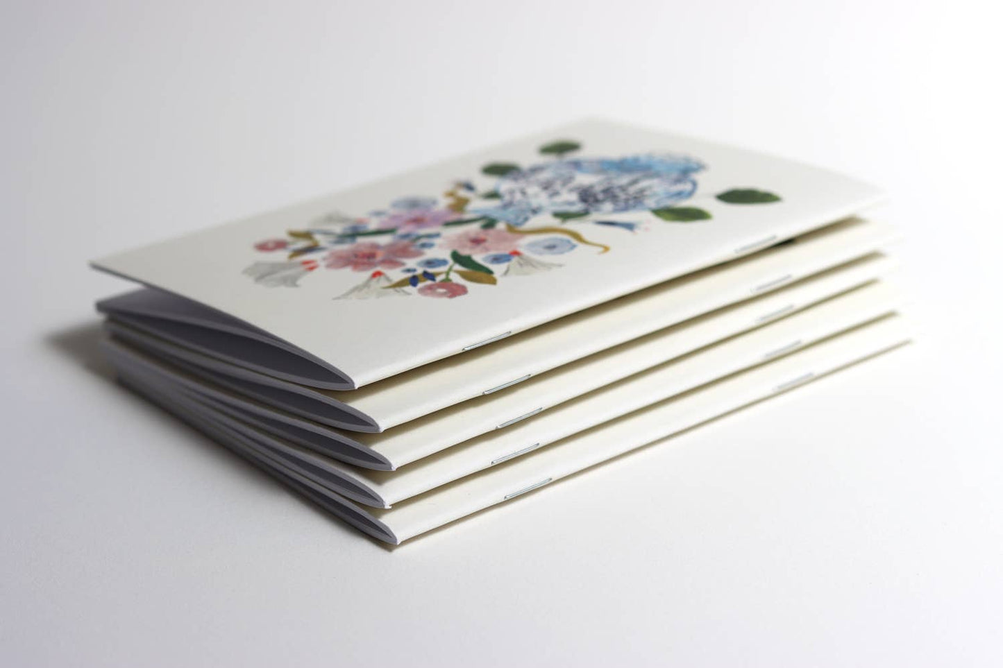 Flowers in blue vase pocket notebook - A6 notebook