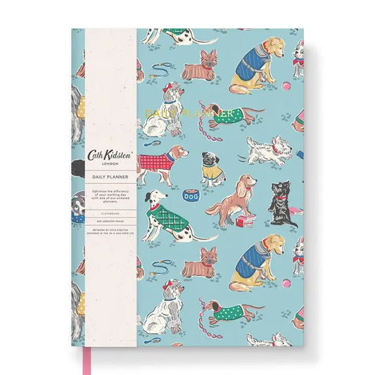 A blue soft covered planner with cartoon dogs on the cover